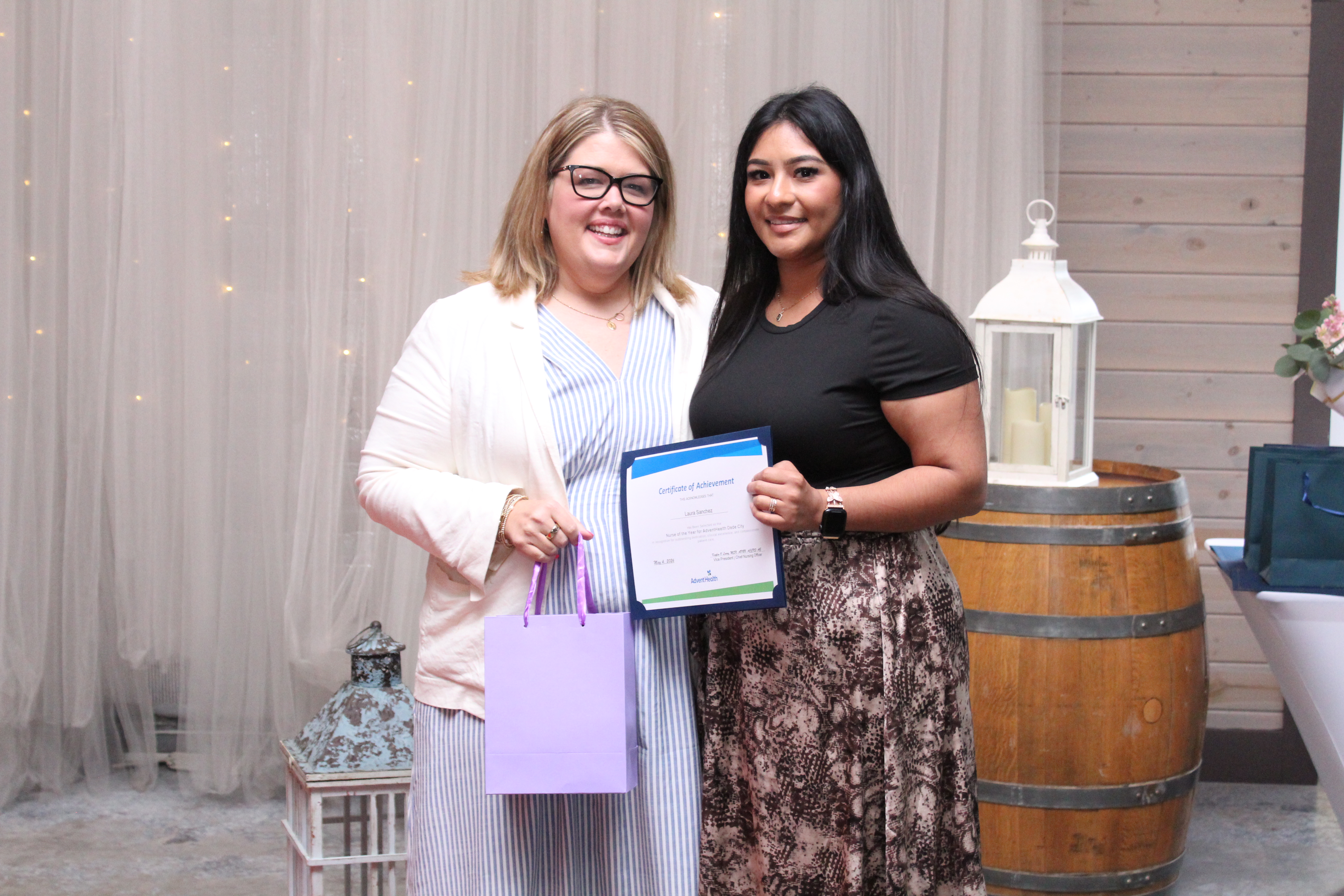 Laura Sanchez, RN, PCU at AdventHealth Dade City, is honored as a Nurse of the Year alongside Chief Nursing Officer Kaylen O’Leary.